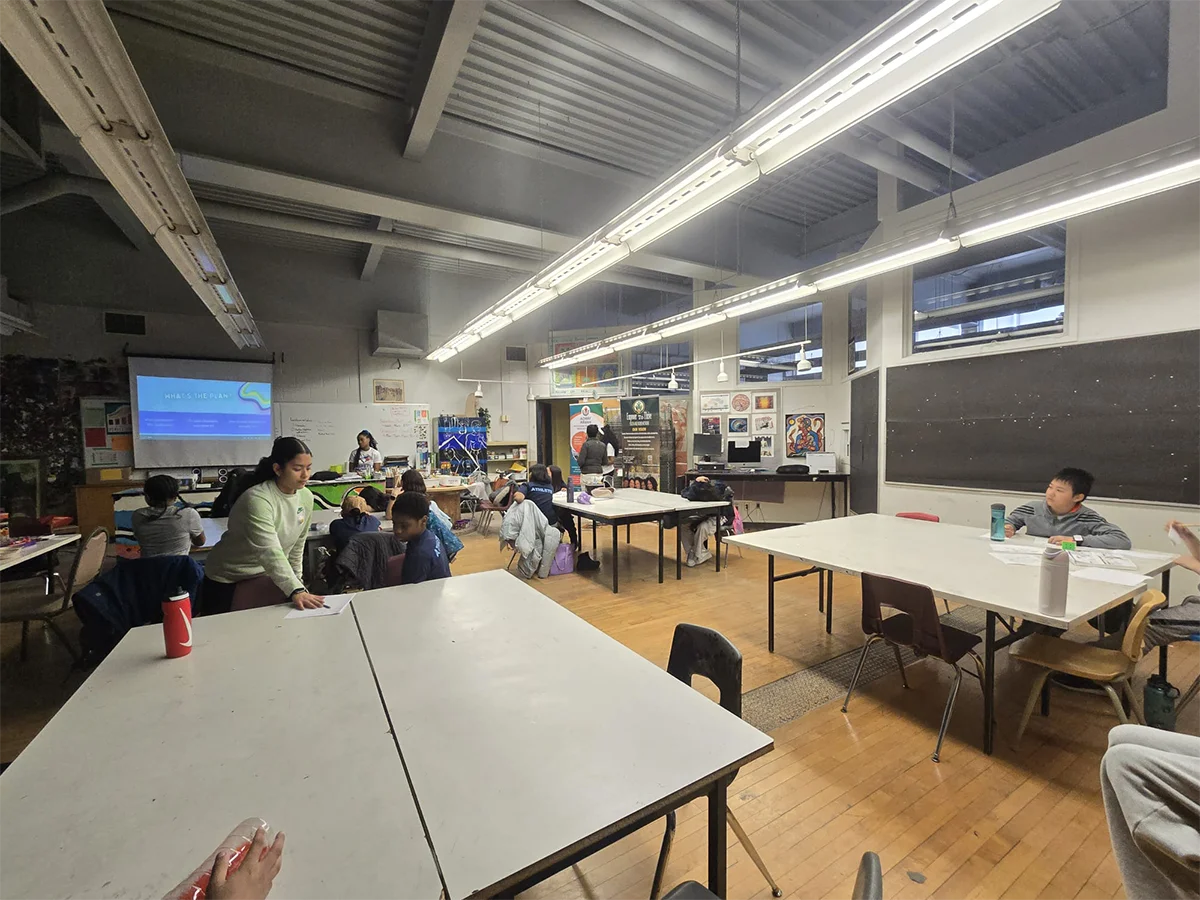 Wide view of the youth workshop classroom during group exercises
