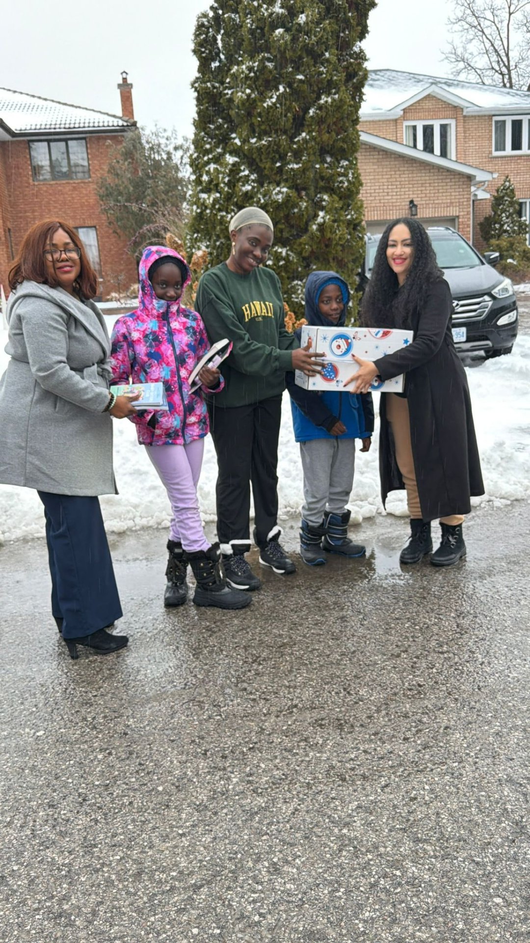 Delivering winter warmth, books, and gift hampers directly to families